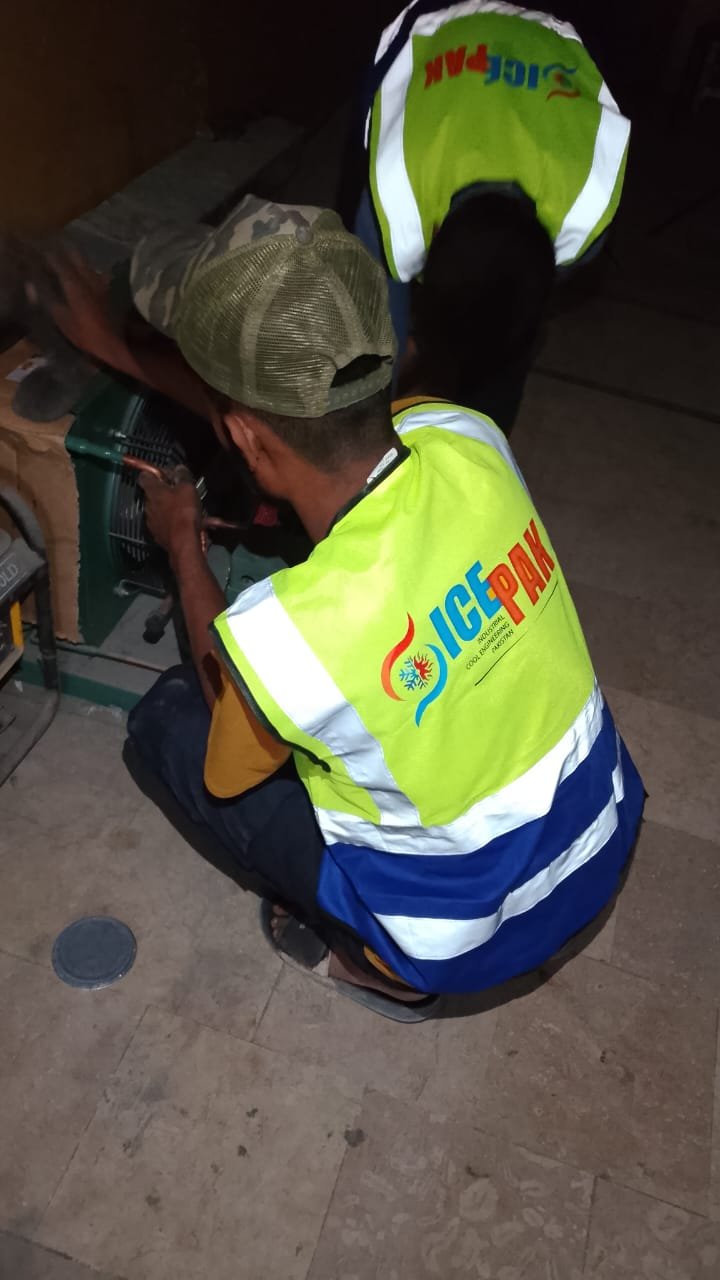 Ice Pak technicians servicing refrigeration equipment